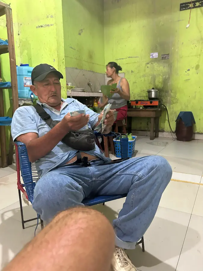 Cesar, making business. His wife, preparing Juanes.
