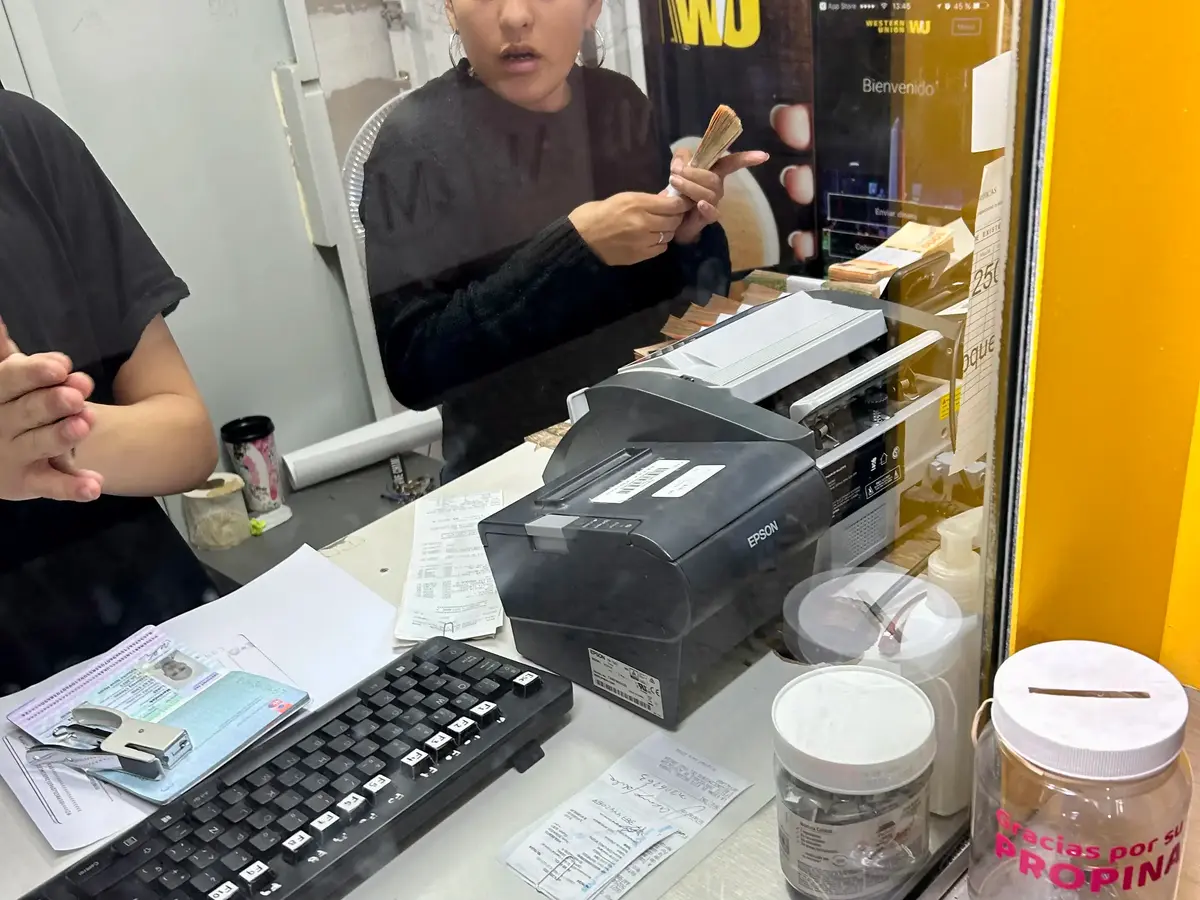 Western Union, if you look closely at the girl, you can see the wads of cash.